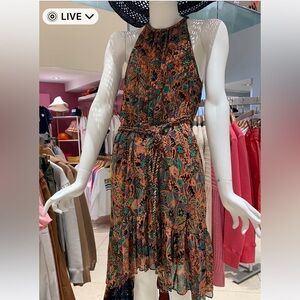 Designer colorful sleeveless dress. Ruffled bottom with braided belt.